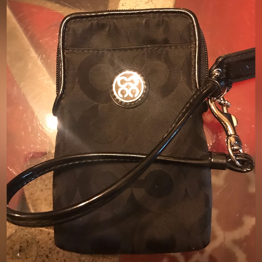 Coach canvas card and phone wristlet. Measurements are 5 1/2” x 3 1/4”.